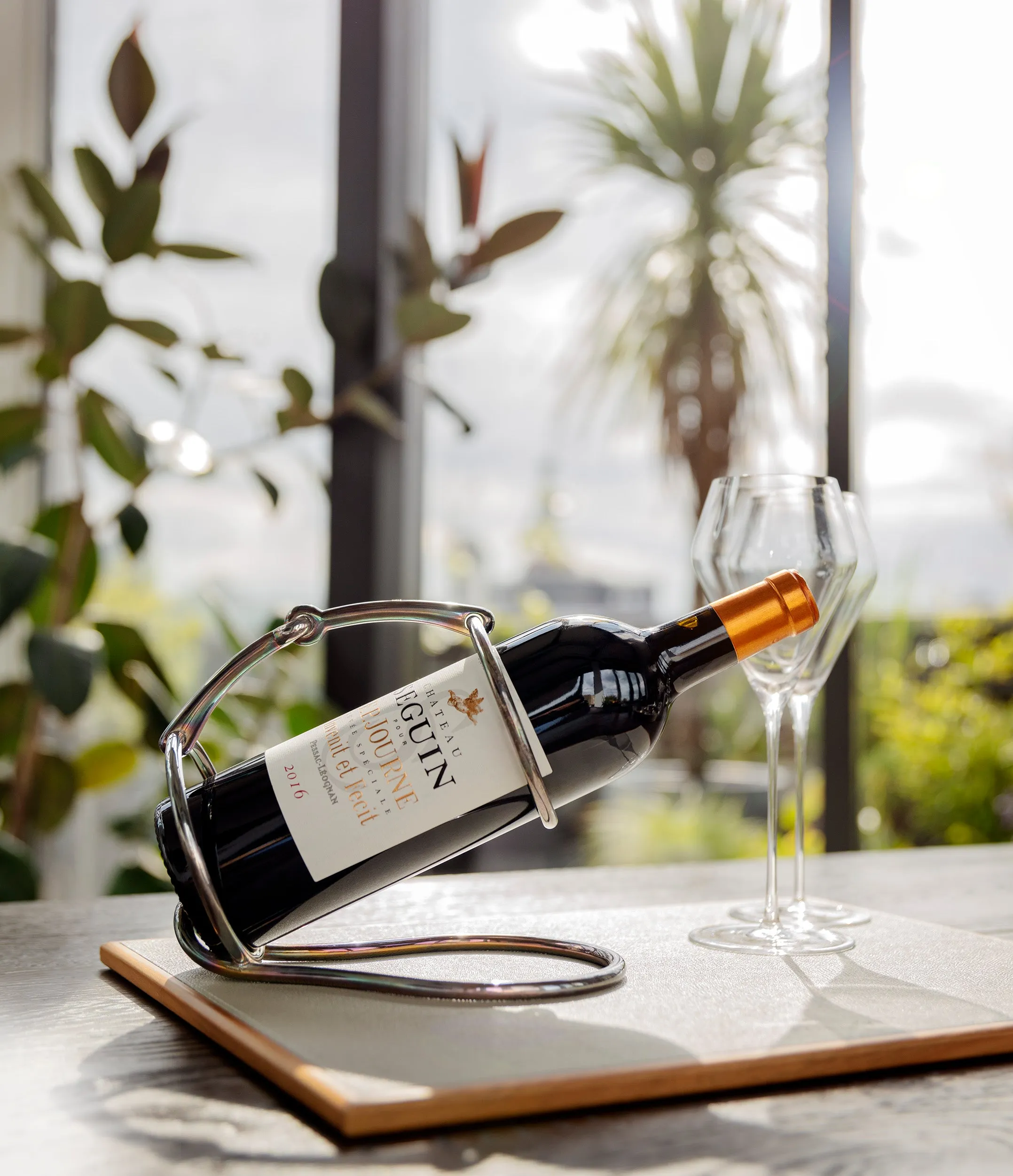 Hermès wine bottle holder | silver-plated with iridescent patina