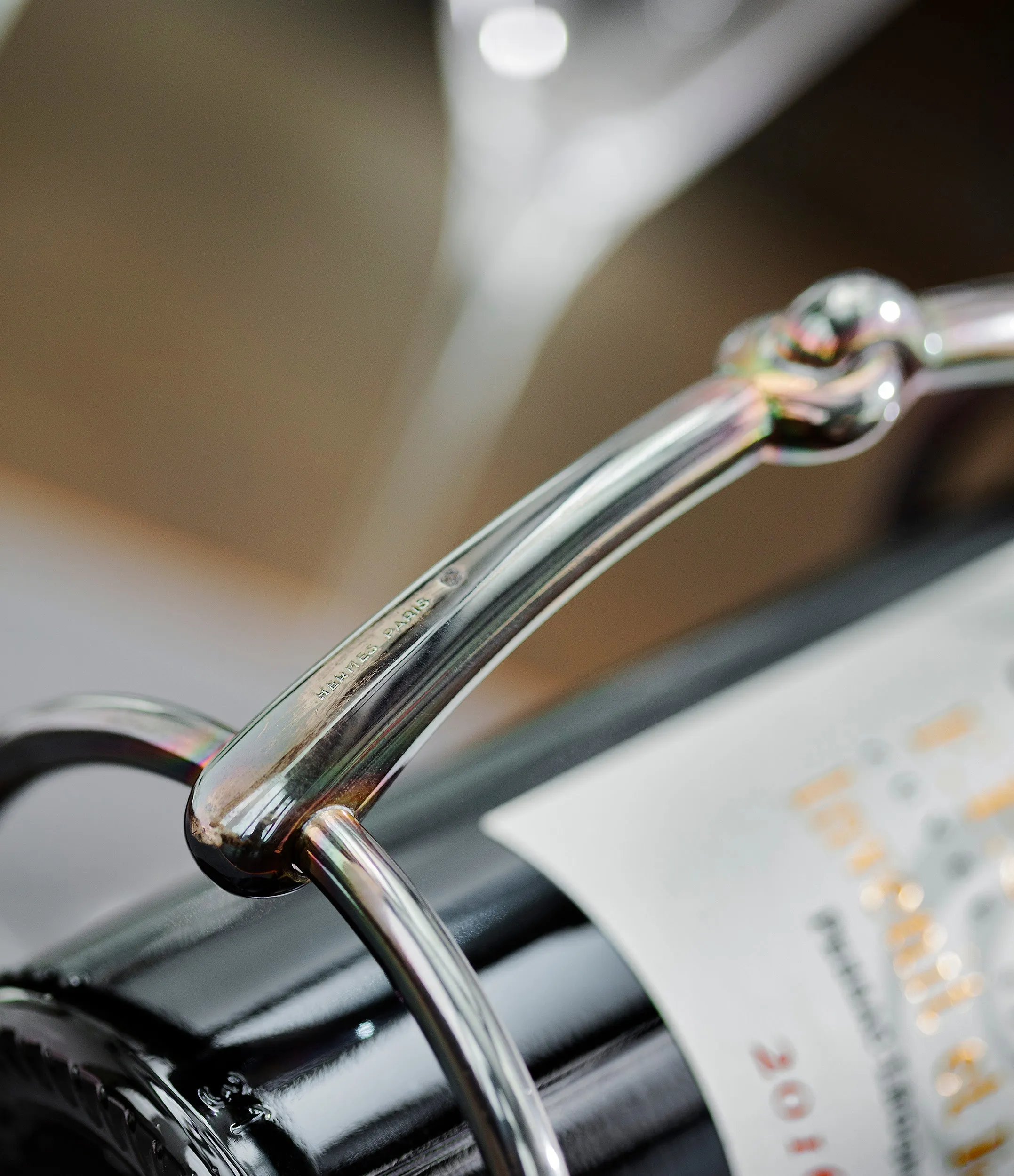 Hermès wine bottle holder | silver-plated with iridescent patina