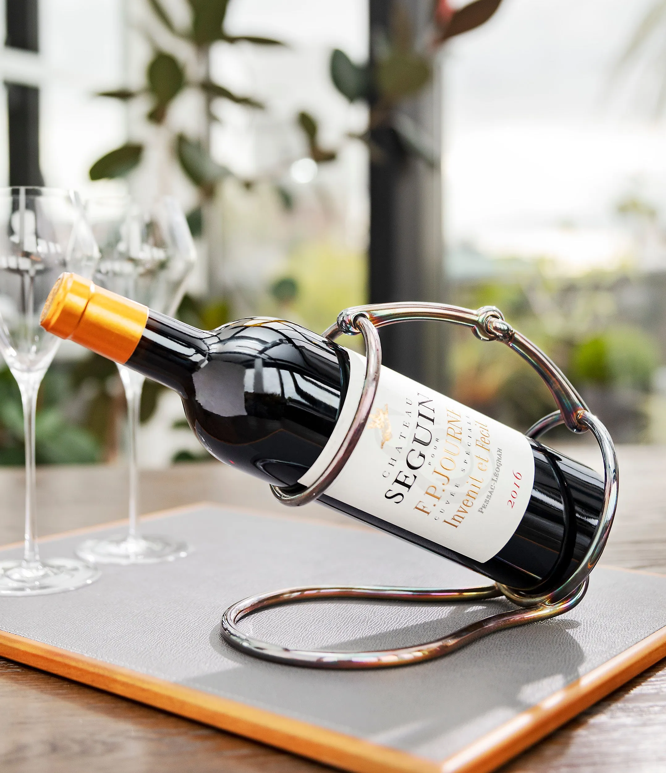Hermès wine bottle holder | silver-plated with iridescent patina