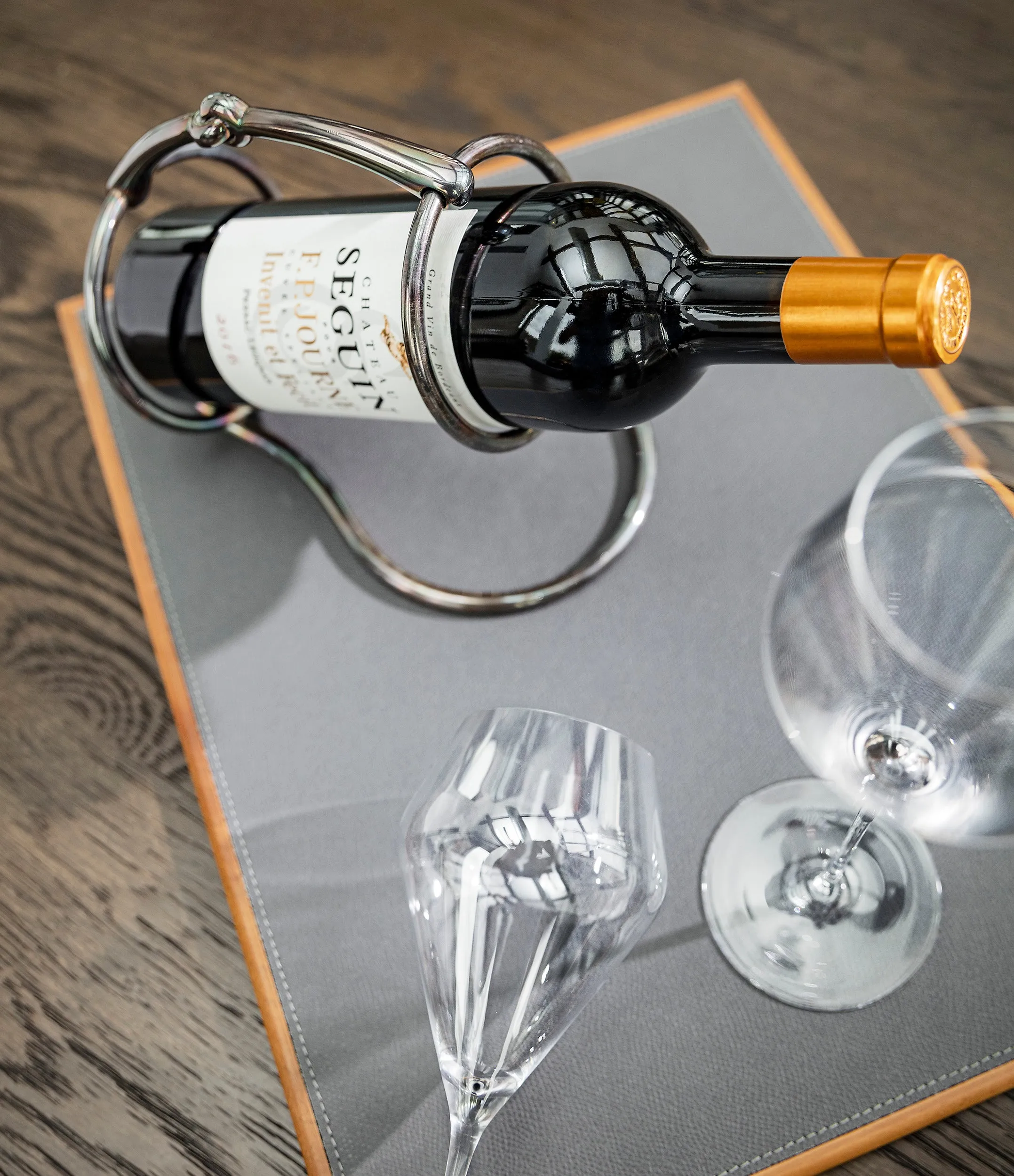 Hermès wine bottle holder | silver-plated with iridescent patina