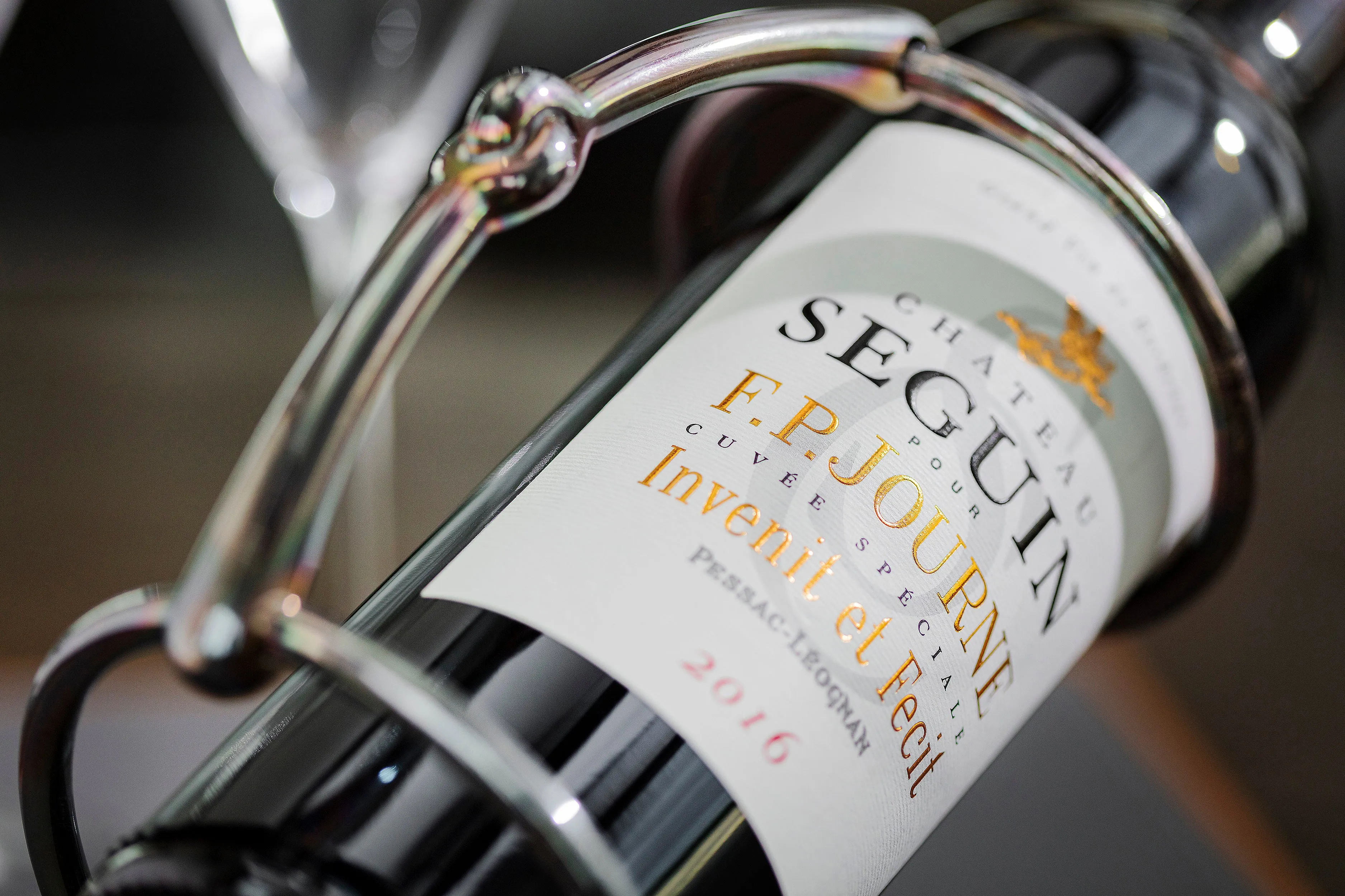Hermès wine bottle holder | silver-plated with iridescent patina