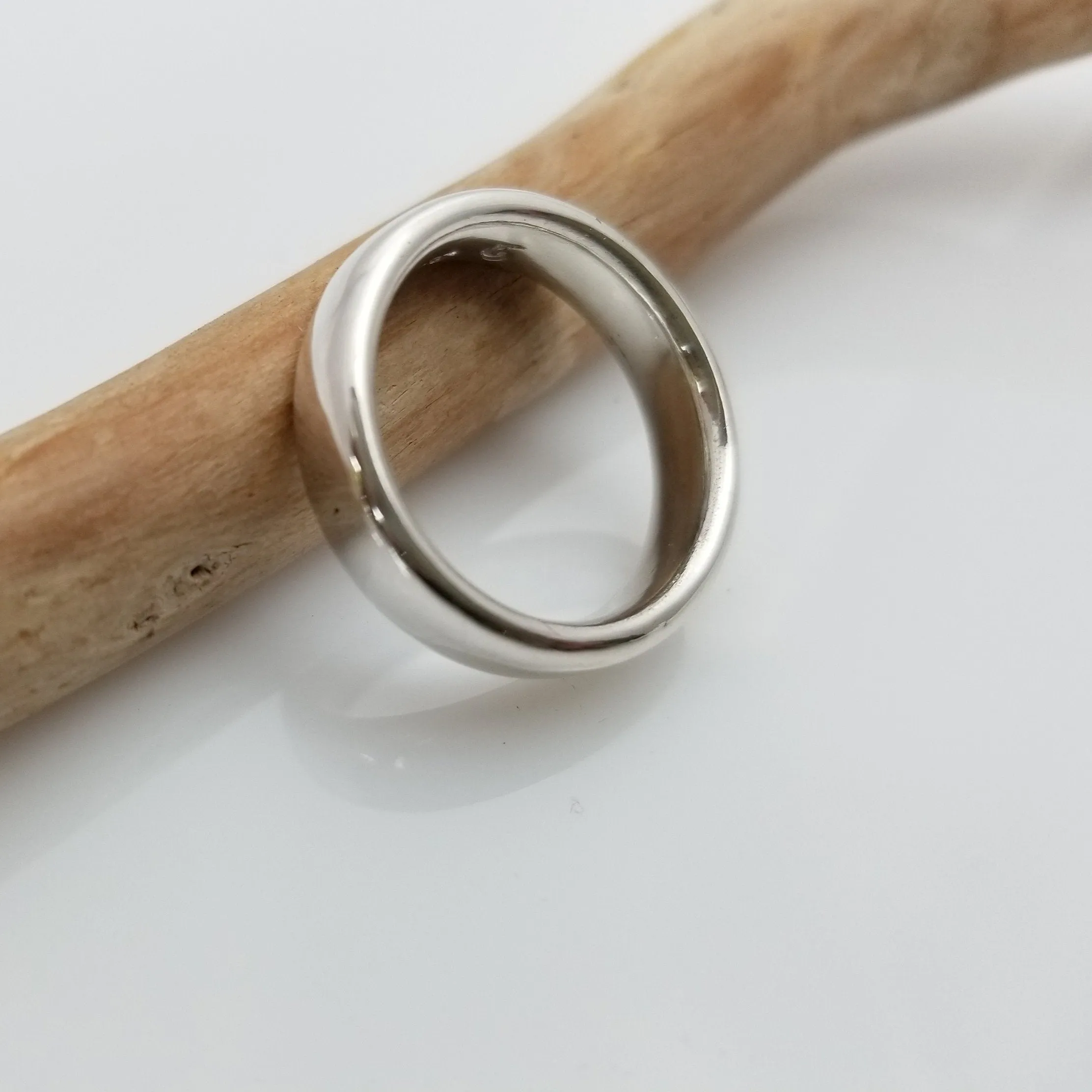 "New Moon Ring, Timeless Elegance: The Classic Solid Silver Wedding Band"