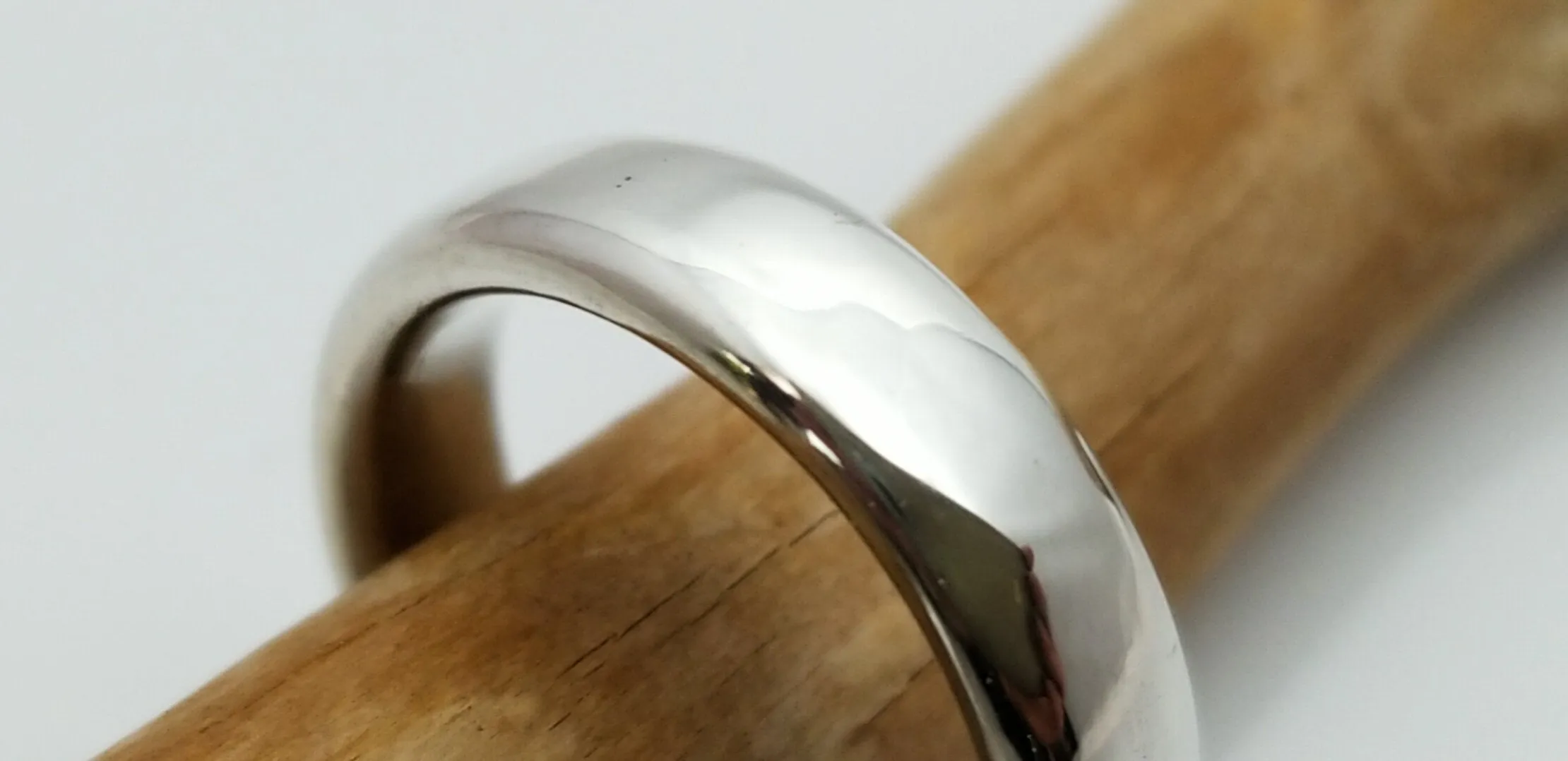 "New Moon Ring, Timeless Elegance: The Classic Solid Silver Wedding Band"