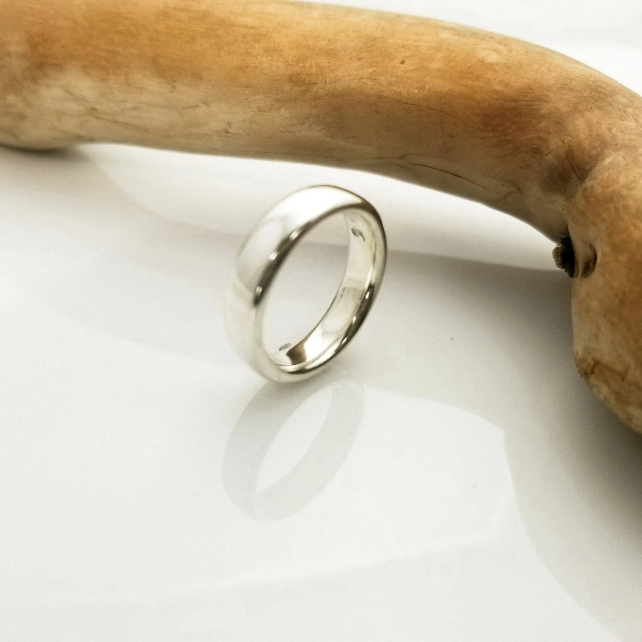 "New Moon Ring, Timeless Elegance: The Classic Solid Silver Wedding Band"
