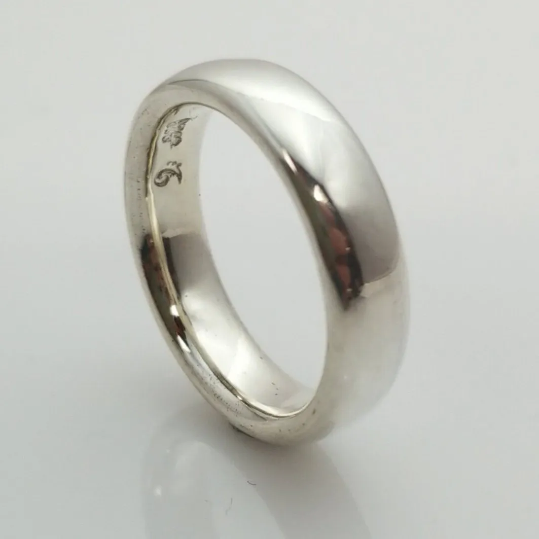 "New Moon Ring, Timeless Elegance: The Classic Solid Silver Wedding Band"